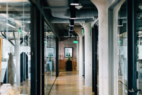 Modern, clean office with organized workstations.